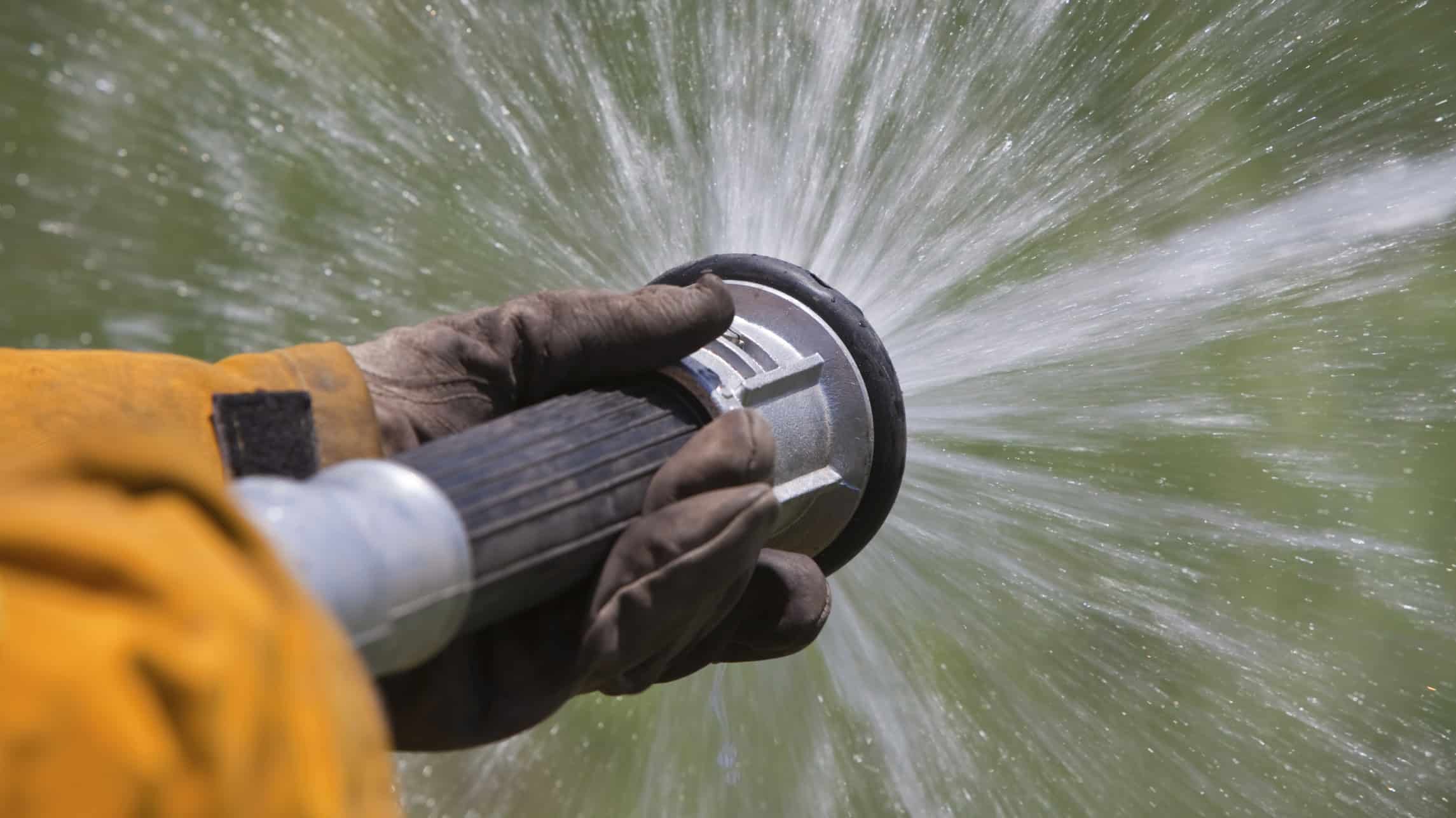 a firehose sprays water