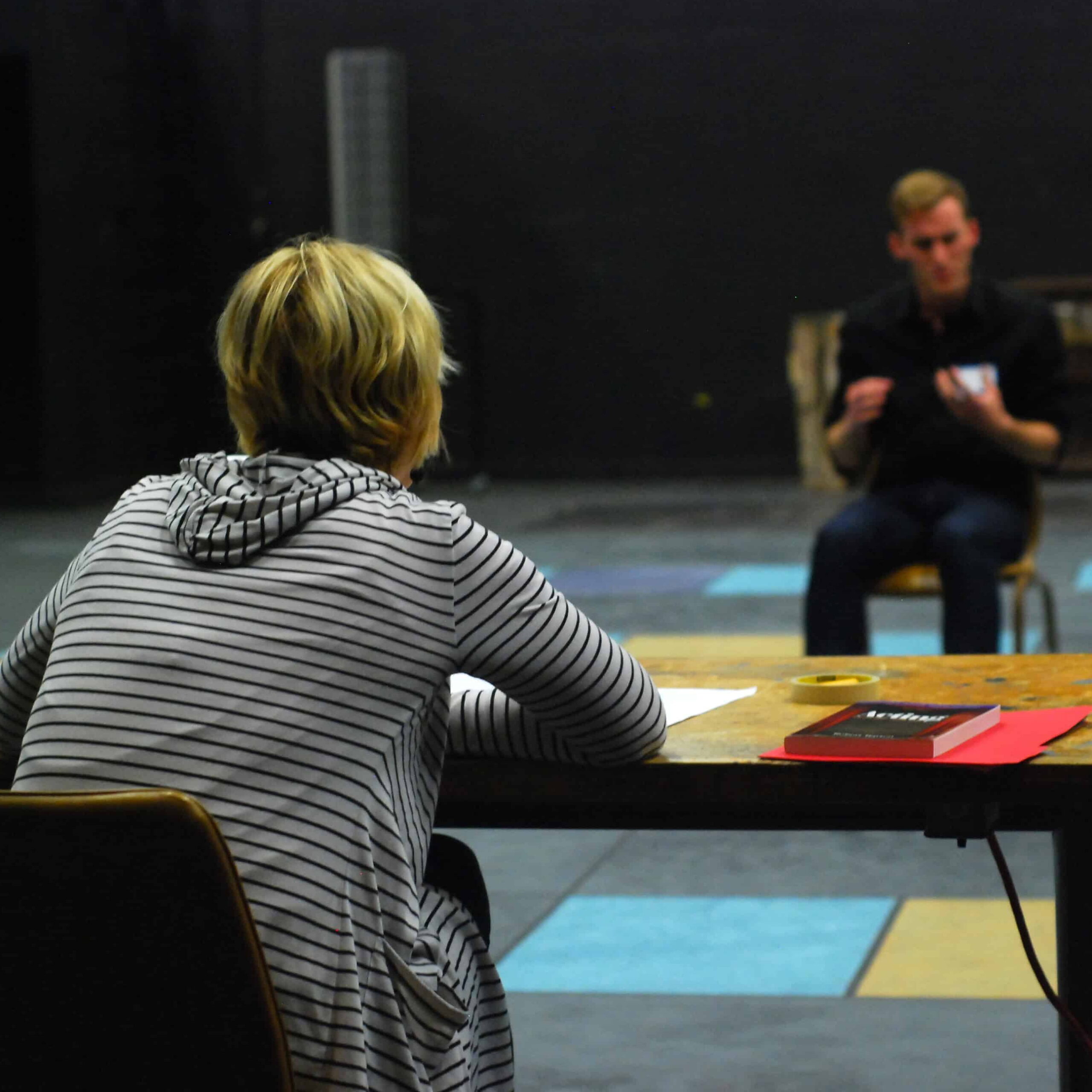 An actor performs a monologue for an audition panel.