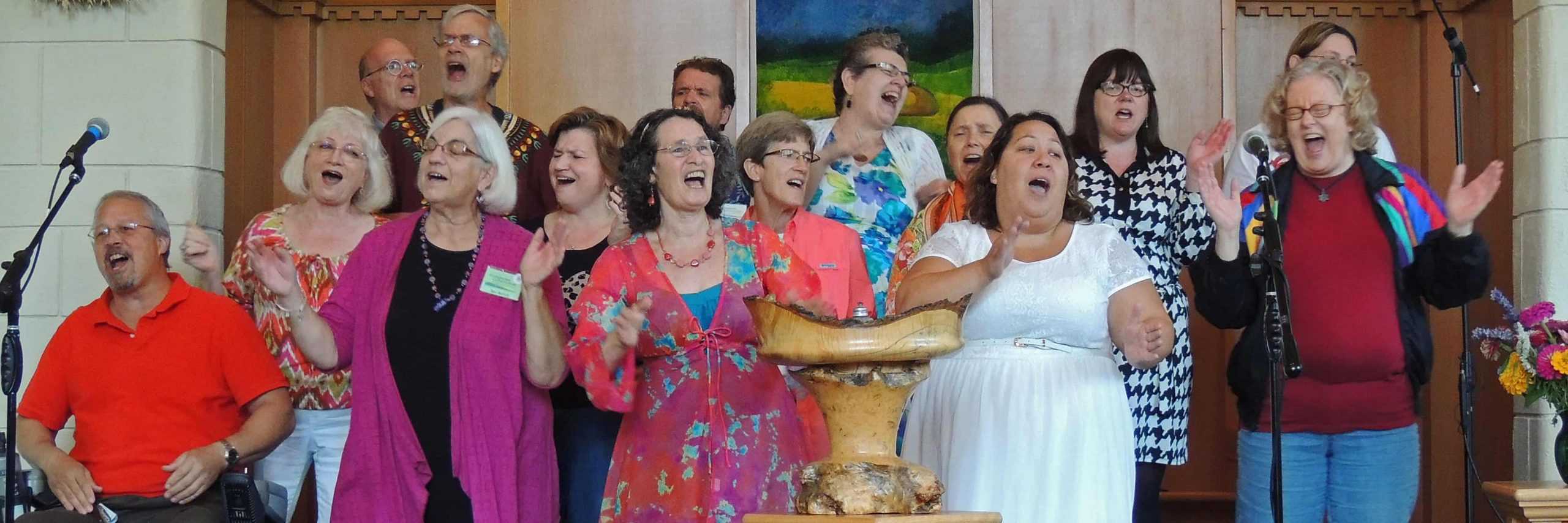 Photo of the UUCV choir singing enthusiastically