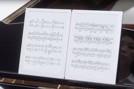 photo of GVIDO digital score reader on piano